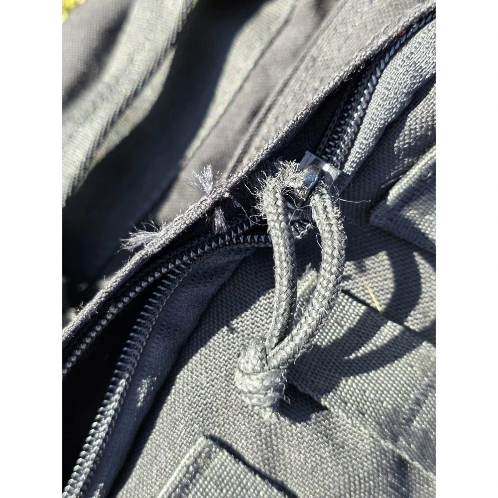 black tactical backpack is a Sandpiper of California Bugout Bag **see Pics**